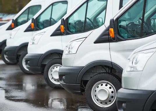 A fleet of vans from a contracting business that expanded to offer HVAC services by partnering with a licensed contractor who can act as a qualifier.